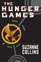 The cover for The Hunger Games. A gold mockingjay sits on top of an arrow, in a gold circle. It is outlined by gray dashes. Connected to the mockingjay are two other gray sets of circles on a black background. 